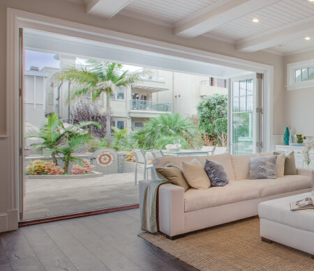 Ultra Series folding door with Satin Nickel hardware and ovolo-profile PDL bars.