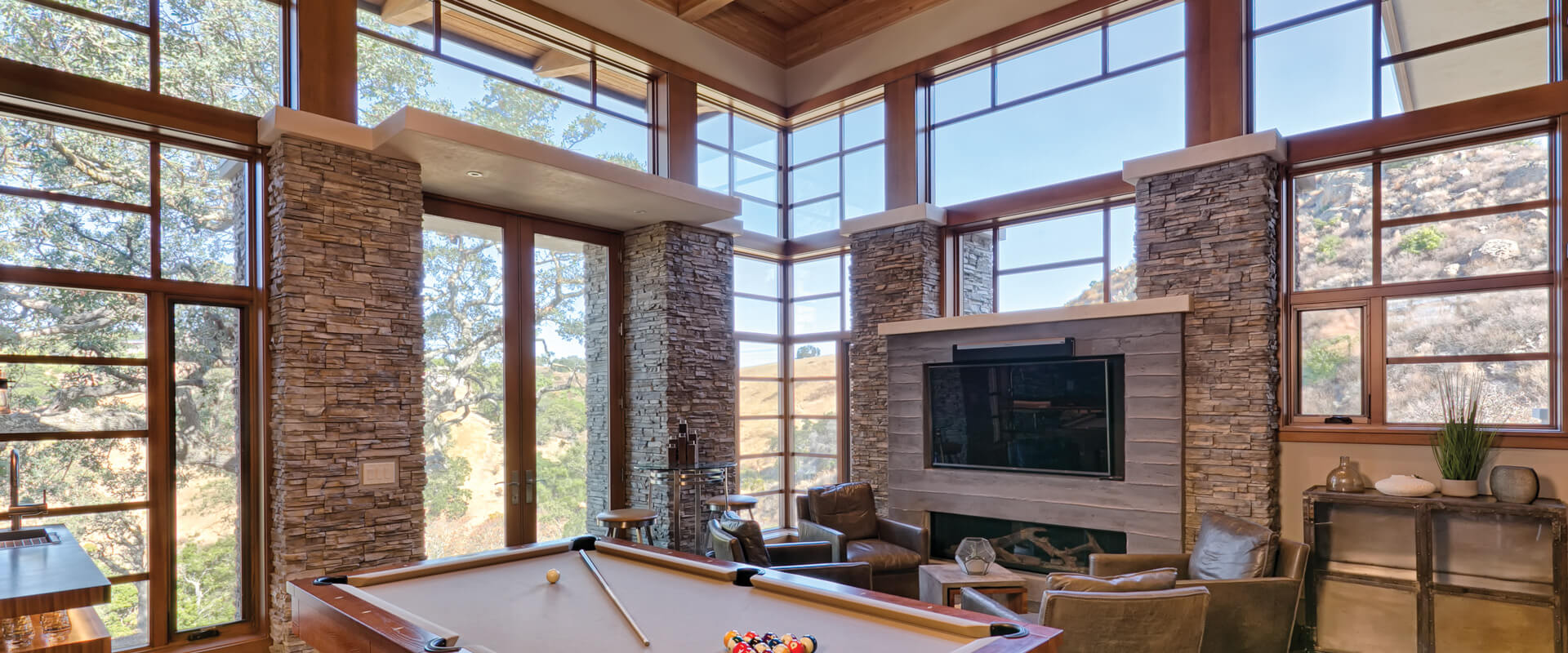 Ultra Series 90-dgree corner windows, direct sets and crank-out ep casement with PDL bars interior game room